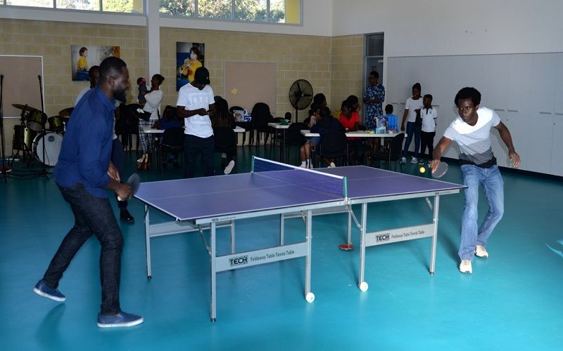 Young people from the church playing table tennis in the community hall